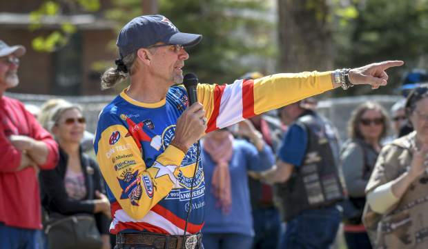 Former NASCAR driver Kyle Petty directs riders for a commemorative photo in front of Hotel Colorado Sunday afternoon. The Charity Ride bought out the hotel for the night as it travels across the country raising money for Victory Junction.