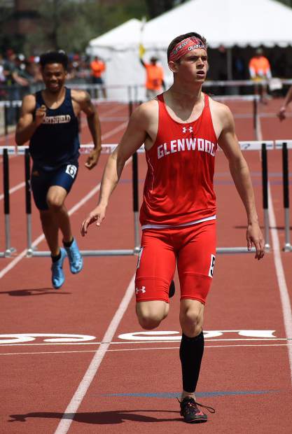 Glenwood senior Wyatt Ewer looks up at the scoreboard to see his final time in a 110m hurdle heat race Friday morning at JeffCo Stadium. Ewer won the heat and advanced to the 4A 110m hurdle final Saturday.