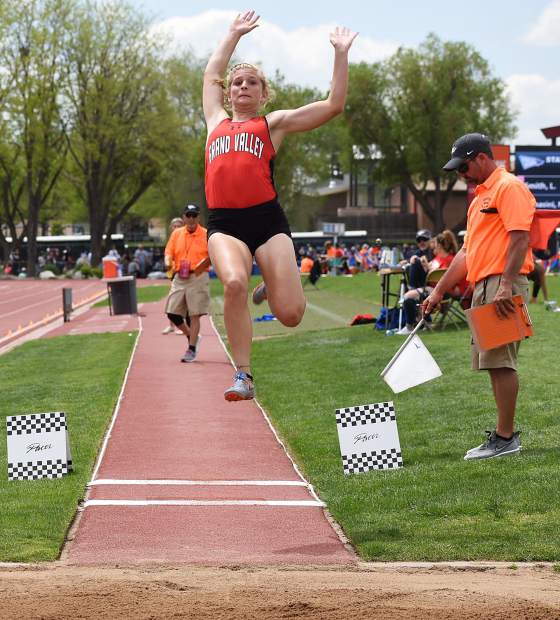 Grand Valley senior Shaya Chenoweth flies through the air toward the sand pit in the 3A long jump Friday in Lakewood.