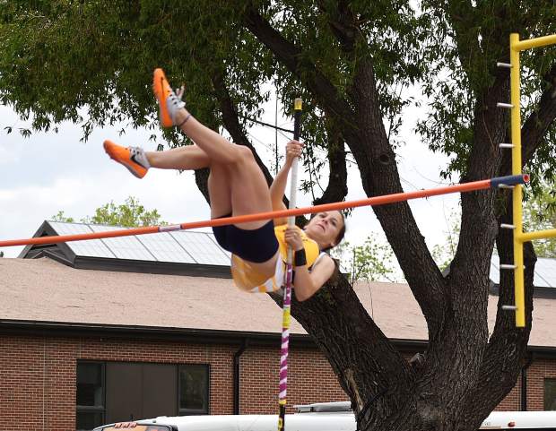 Rifle pole vaulter Ashley Manera clears the bar early in the competition Friday at JeffCo Stadium.
