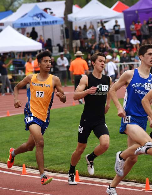 Roaring Fork’s Ronald Clemente races into the second turn of the 800m run Friday at JeffCo Stadium.
