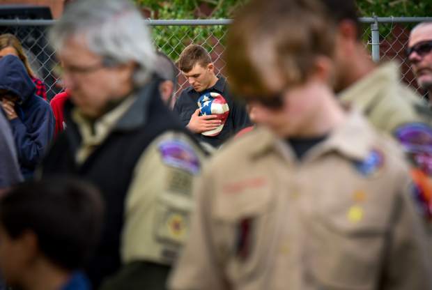 A member of the audience lowers his head during the Benediction near the closing of the 2019 Memorial Day ceremony held at Rosebud Cemetery in Glenwood Springs on Monday.