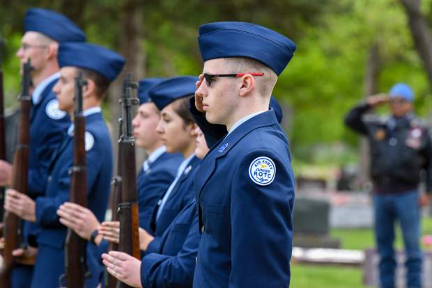 Members of the Glenwood Springs High School Air Force JROTC stand together following the Salute of the Dead near the closing of the 2019 Memorial Day ceremony held at Rosebud Cemetery in Glenwood Springs on Monday.