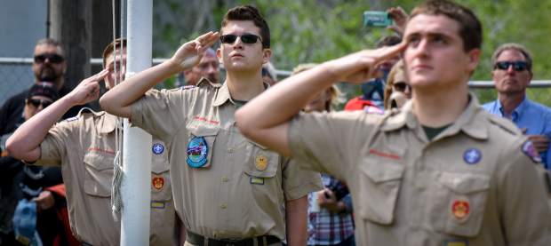 Members of Boy Scout Troop 225 salute the flag during the lowering of the colors during the the 2019 Memorial Day ceremony held at Rosebud Cemetery in Glenwood Springs on Monday.