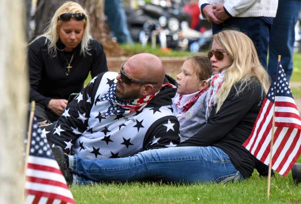 Members of the audience sit together during the opening of the 2019 Memorial Day ceremony held at Rosebud Cemetery in Glenwood Springs on Monday.