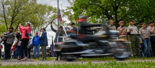 People watch as the Western Slope Memorial Riders leave Rosebud Cemetery during the closing of the 2019 Memorial Day ceremony on Monday morning.